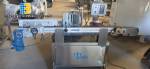 Automatic self-adhesive labeling machine for cylindrical bottles