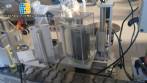 Automatic self-adhesive labeling machine for cylindrical bottles