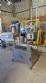 Automatic self-adhesive labeling machine for cylindrical bottles