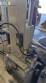 Automatic self-adhesive labeling machine for cylindrical bottles