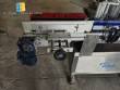Automatic self-adhesive labeling machine for cylindrical bottles