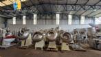 Set of ten stainless steel coating pans with capacities between 150 liters and 350 liters