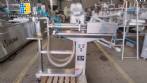 Filling machine with 2 nozzles for liquids and pilfer cap screwer