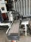 Automatic baling machine with shrink tunnel for bottles and jars in bales.