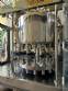 Packaging line with IMSB bung capper, Maqmundi labeler and accumulator table