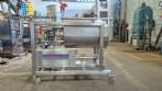 Unifiller stainless steel dosing pump with homogenizing mixer for bakery foods.
