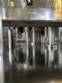 Gravimetric rotary filling machine in stainless steel with cabin