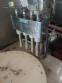 Erli rotary liquid filling machine with 4 pistons, 14,400 units per hour.
