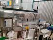Automatic labeler for flat bottles