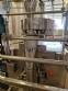 Vertical wrapping machine for triangular format