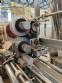 Vertical wrapping machine for triangular format