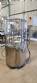 Bottle and jar screwing machine with automatic cap feeding system