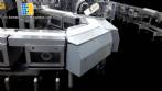 Distribution, phasing and feeding system for Cavanna packaging machines