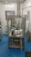 Rotmaq screw capping machine with cap positioning elevator