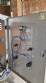 Labeling machine with steam sleeve tunnel and bottle baler