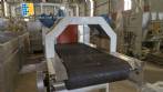 Labeling machine with steam sleeve tunnel and bottle baler