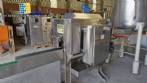 Labeling machine with steam sleeve tunnel and bottle baler