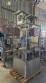 Labeling machine with steam sleeve tunnel and bottle baler