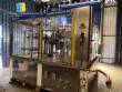 Zegla rotary filling machine with rinser and three-block capping system.