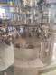 Zegla rotary filling machine with rinser and three-block capping system.