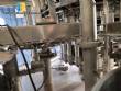 Zegla rotary filling machine with rinser and three-block capping system.