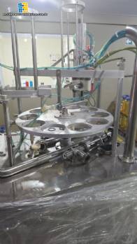 Rotary filling machine with capping and sealing unit for Mirainox cups and jars for pasty products.