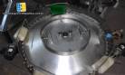 Rotary feeder of bullets and chewing gum type Flow Pack machines