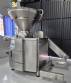 Handtmann vacuum stuffer with twister and tilting elevator, up to 6,000 kg per hour.