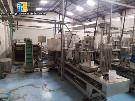 Automatic filling and sealing machine for gelatin cups, 12,000 units/hour. Automatic filling and sealing machine for gelatin cups, 12,000 units/hour.